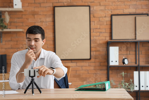 Young man with earphones an...