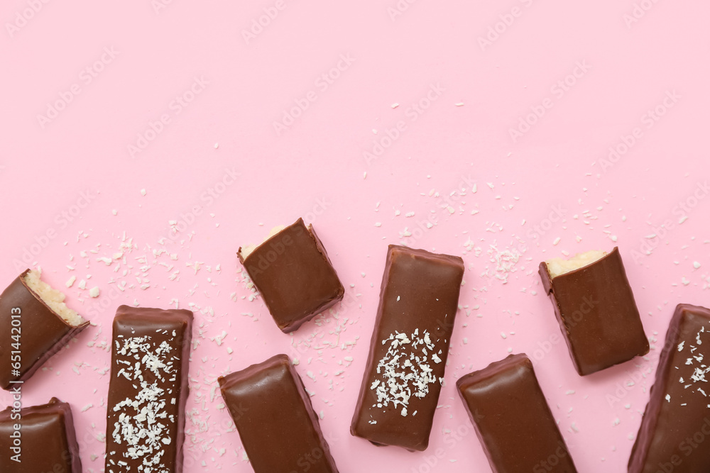 Tasty chocolate covered coconut candies on pink background - obrazy, fototapety, plakaty 