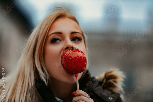 Apple in hand, woman admires cultural wonders photo