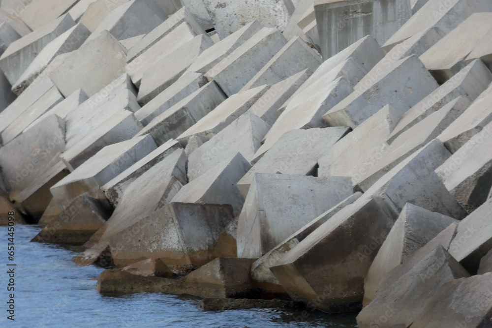 large chunks of concrete creating a harbour breakwater large chunks of concrete creating a harbour breakwater