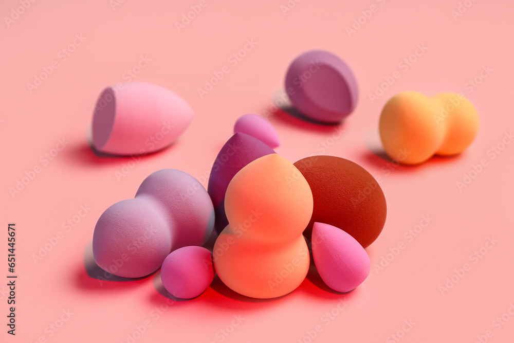 Different makeup sponges on pink background Different makeup sponges on pink background