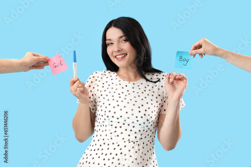 Happy young woman with preg...