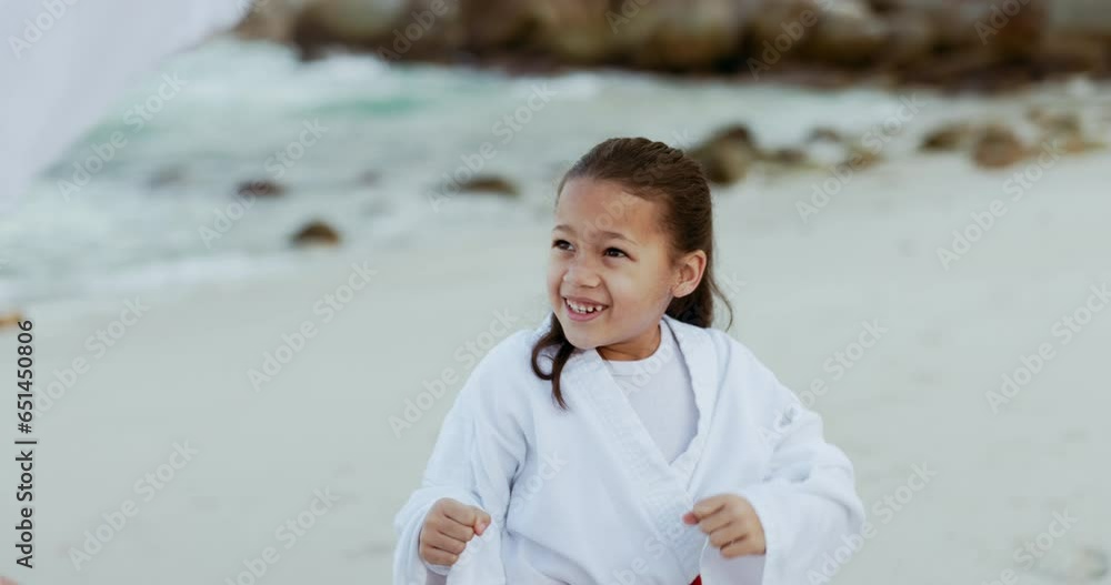 Beach, karate punch or child learning martial arts, fighting or taekwondo in fitness coaching. Challenge, kung fu or teacher teaching a kid, girl or student in workout, exercise or training at sea