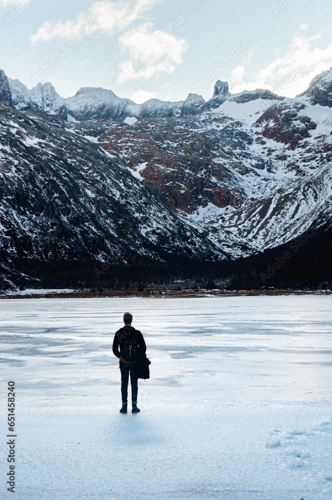 man contemplating snowy mountain in solitude, Ushuaia Laguna Esmeralda