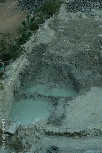 Bricks, stones, cement, and sand as construction materials for building and infrastructure