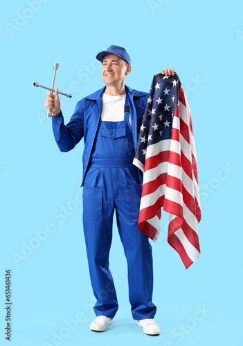 Mature mechanic with cross ...