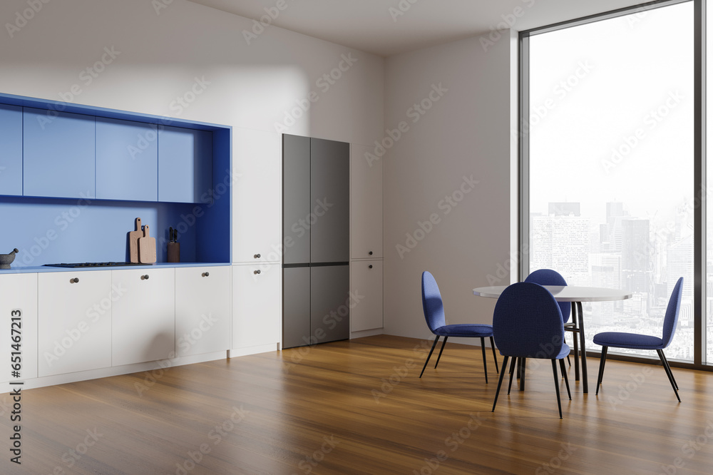 Fototapeta premium White and blue kitchen corner with dining table