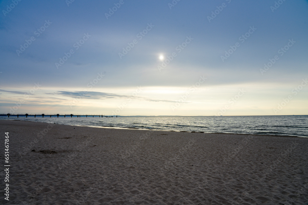 Sunset on the Baltic Sea in Poland. Landscape in the evening with setting sun by the sea.