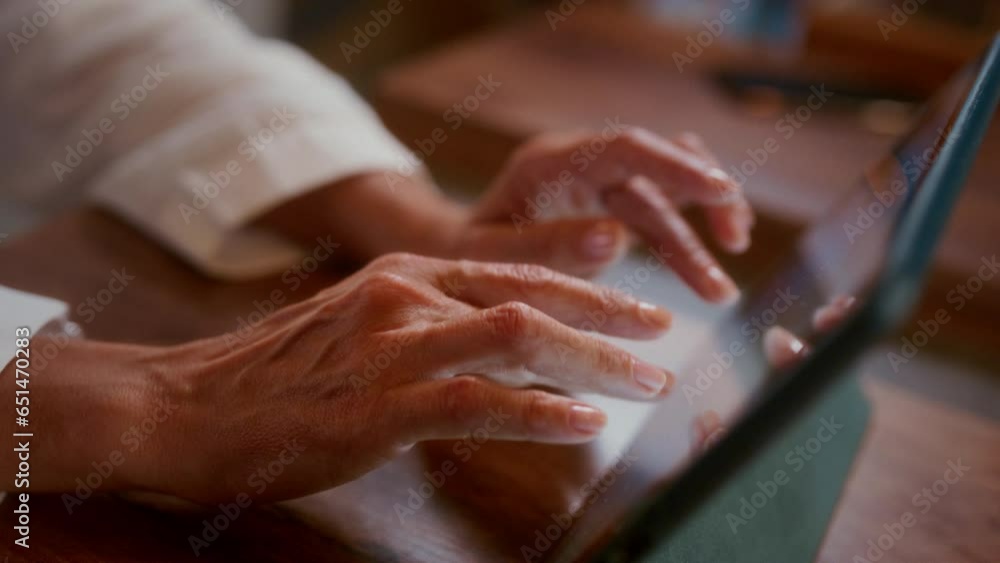 Close-up: female hands typing on a tablet screen in a cafe. Wrinkled fingers themselves touch the touchscreen in a coffee shop or restaurant. Grandma writes a message. Typing text, freelancer. Close-up: female hands typing on a tablet screen in a cafe. Wrinkled fingers themselves touch the touchscreen in a coffee shop or restaurant. Grandma writes a message. Typing text, freelancer.
