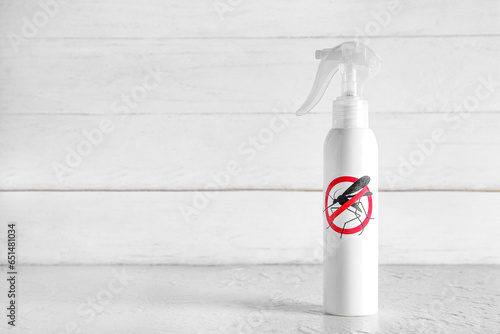 Mosquito repellent spray on table photo