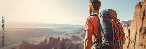 Climber near the mountain top, beautiful landscape in the sun - The Climbing Sports Series