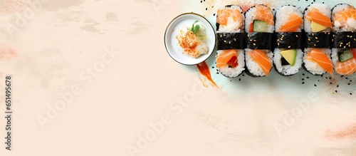 Isolated menu item Salmon sushi maki with hot sauce wrapped in nori on a isolated pastel background Copy space