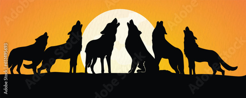 Group of Wolf standing on cliff and howling at moon isolated on evening background 
