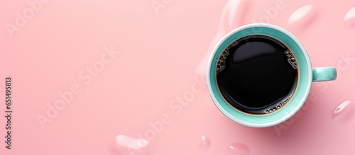 Black cup blending into isolated pastel background Copy space