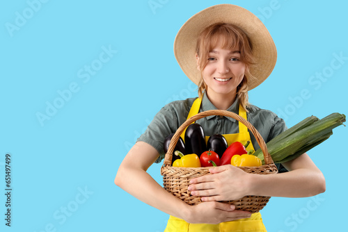 Happy young female farmer w...