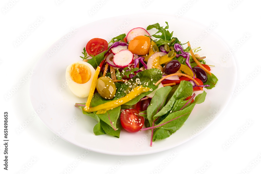 Green vegan salad with spinach, eggs and vegetables, isolated on white background.