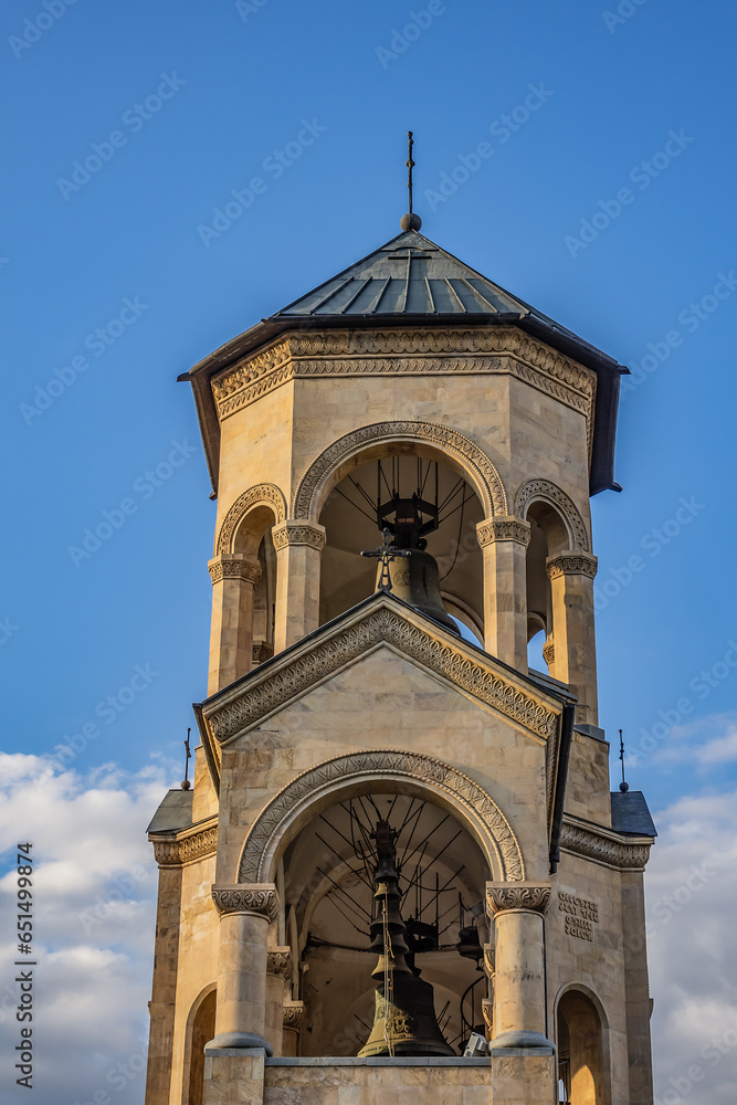 Fototapeta premium Holy Trinity Cathedral of Tbilisi, (known as Sameba Cathedral) on Elia Hill. Bell tower, which stands at a height of 73 meters and has nine bells. Tbilisi, Georgia. 