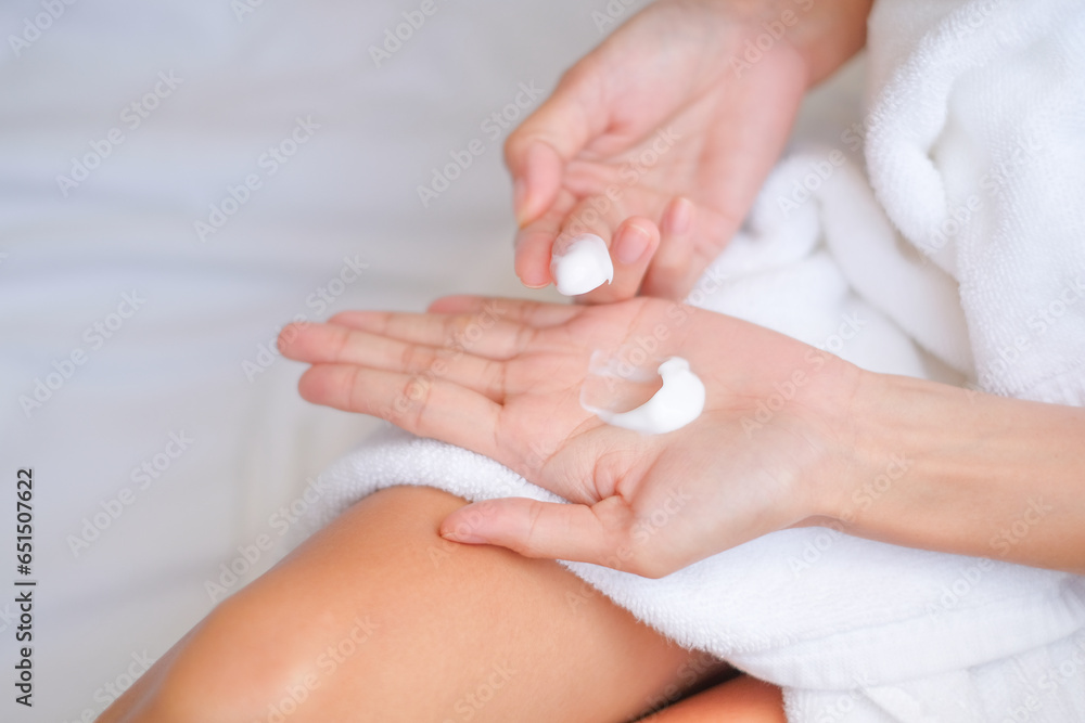 Woman applying natural cream, Woman moisturizing her hand with cosmetic cream, Spa and Manicure concept.