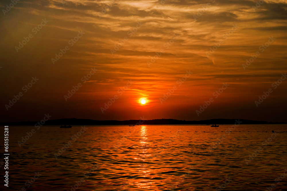 beautiful sunset on the sea with cirrus clouds. Travel and recreation