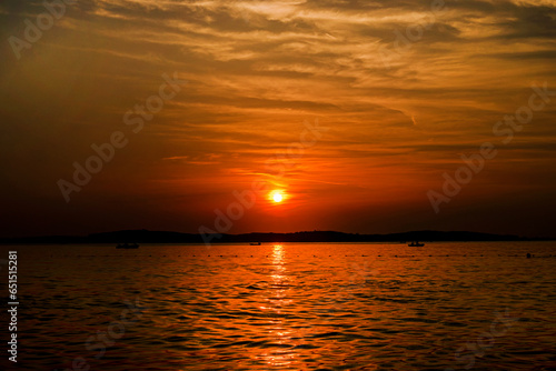 beautiful sunset on the sea with cirrus clouds. Travel and recreation