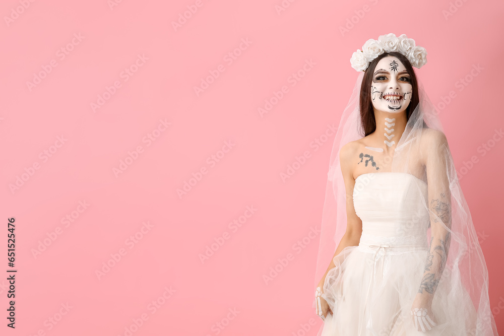 Beautiful young woman dressed as dead bride for Halloween party on pink background Beautiful young woman dressed as dead bride for Halloween party on pink background