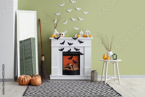 Tableau sur toile Interior of living room decorated for Halloween with fireplace and paper bats