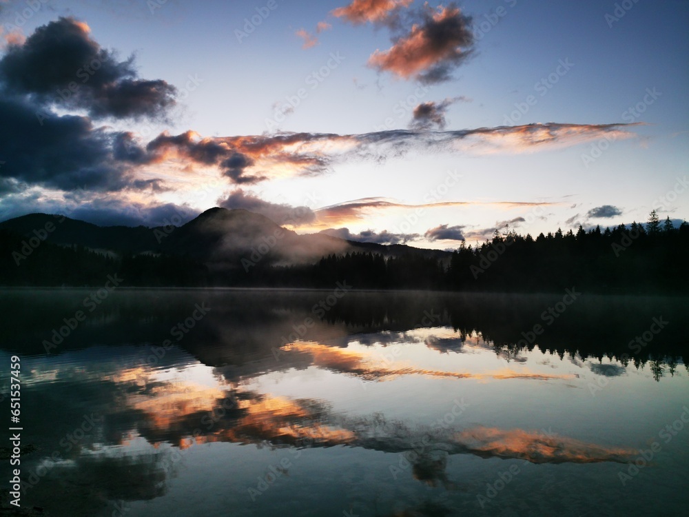 Cloudy sunset over a mountain lake