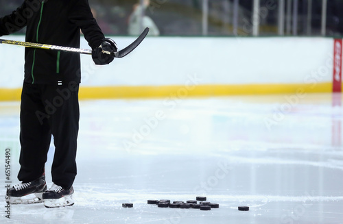 Canvas Print ice hockey player with pucks