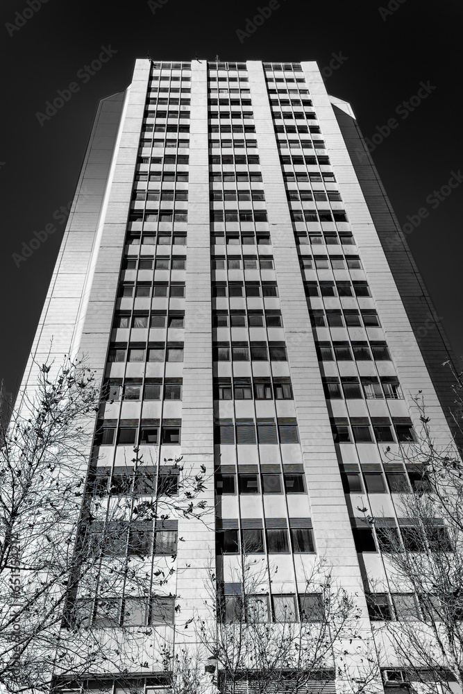 Fototapeta premium Black and white abstract upward view of downtown skyscrapers.