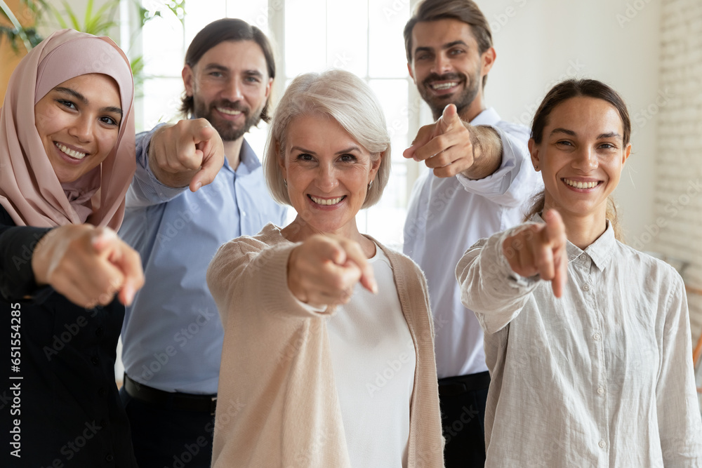 Mature and young staff point finger at camera choosing you. Recruiting agency hr managers give opportunity employment in international company, makes possible to prove yourself and make career concept Mature and young staff point finger at camera choosing you. Recruiting agency hr managers give opportunity employment in international company, makes possible to prove yourself and make career concept