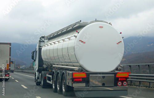 truck for the transport of liquids travels fast on the highway