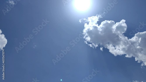 Clouds move and try to cover the sun at midday