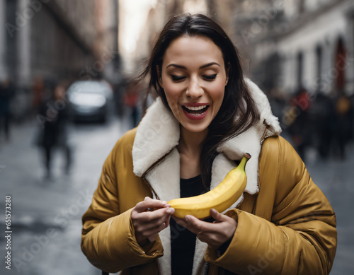 A woman holding a banana
