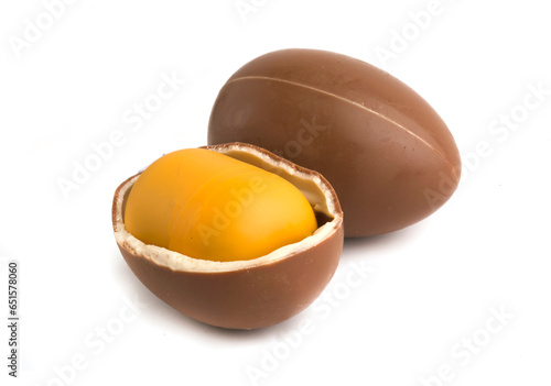 chocolate egg with toy on white background