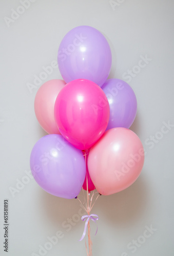 bunch of pink and purple helium balloons, birthday
