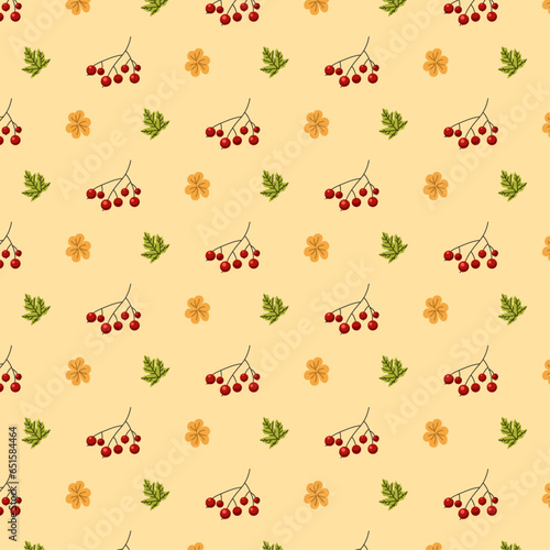 Seamless patternt with yellow and green leaves and red rowans in flat on yellow background for wrapping, wallpapers, packaging, greeting cards, textile, webs