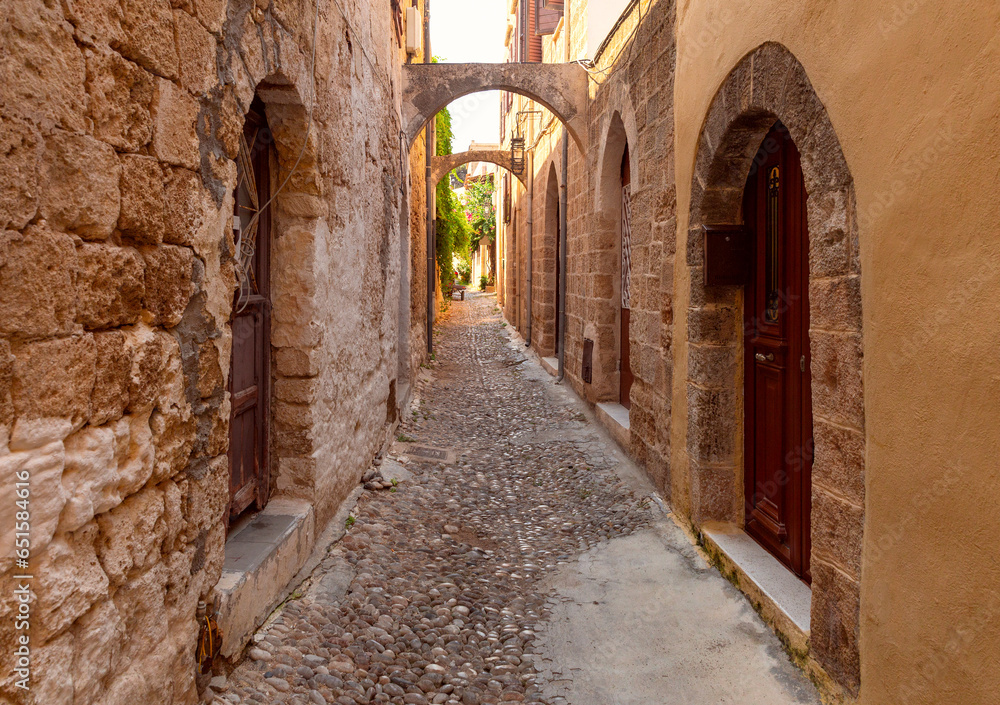 Old narrow traditional city street in Rhodes.