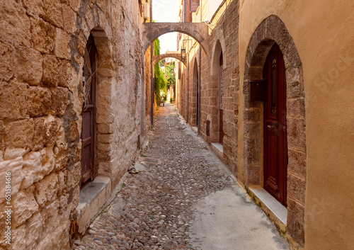 Fototapeta Naklejka Na Ścianę i Meble -  Old narrow traditional city street in Rhodes.