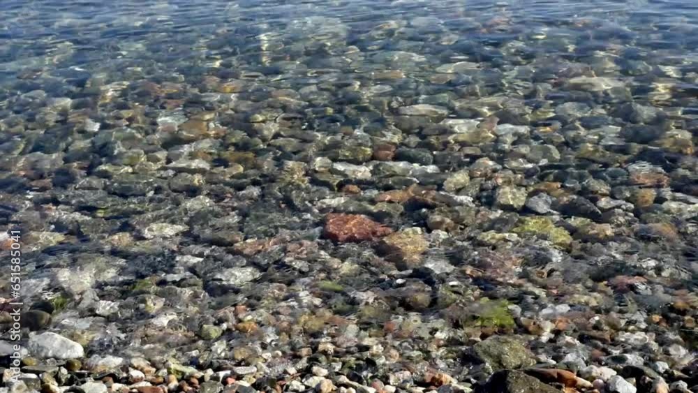 water and stones. Rocky beach with clear clear water. Sea ripples water and stones. Rocky beach with clear clear water. Sea ripples
