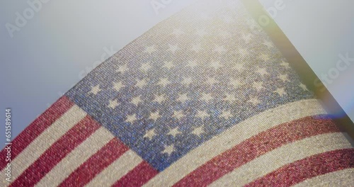 Close up of miniature American flag against sunny sky
