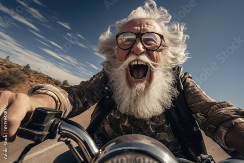 Cool bearded old man biker on a motorcycle