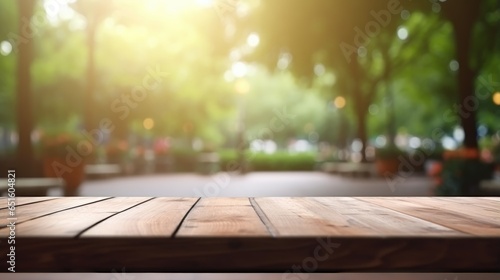 empty wooden table for display with green park background photo