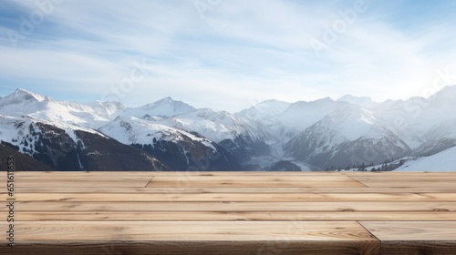 empty wooden table for display with snow mountain background