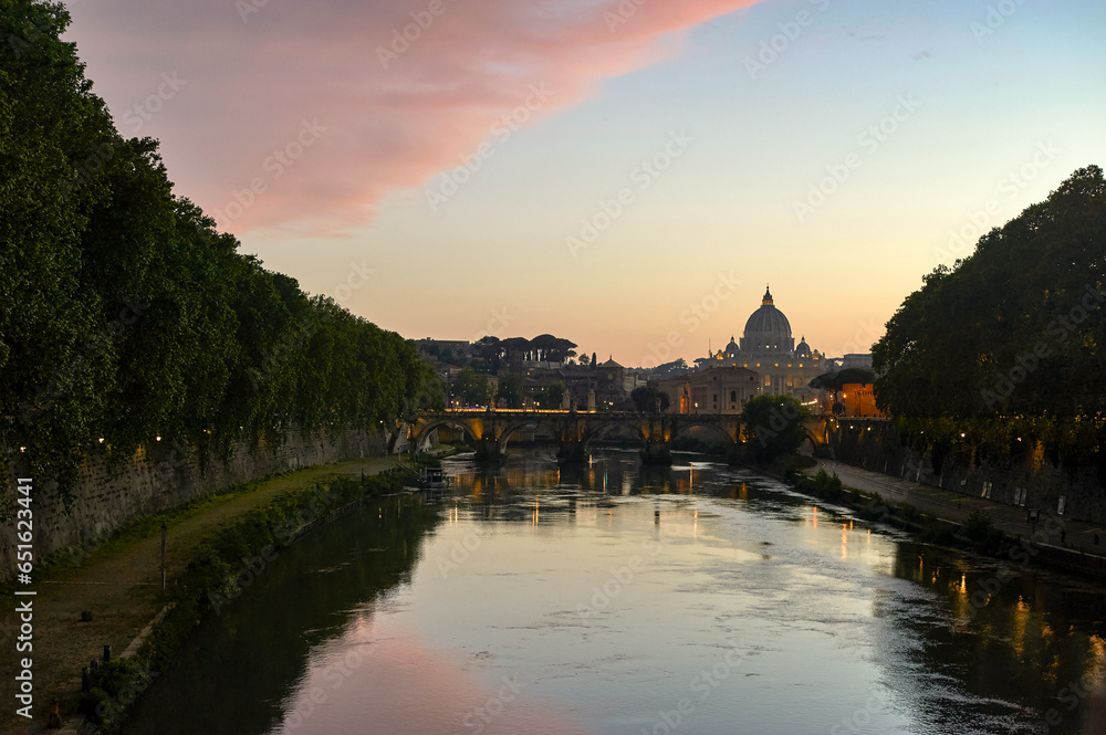 View on San Pietro cathedral from the Tiber River at sunset, Rome