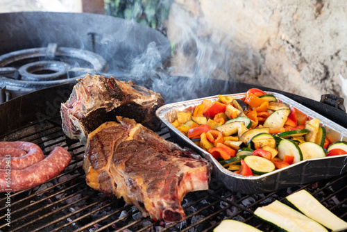 Barbaque outdoors with steak and vegetables
