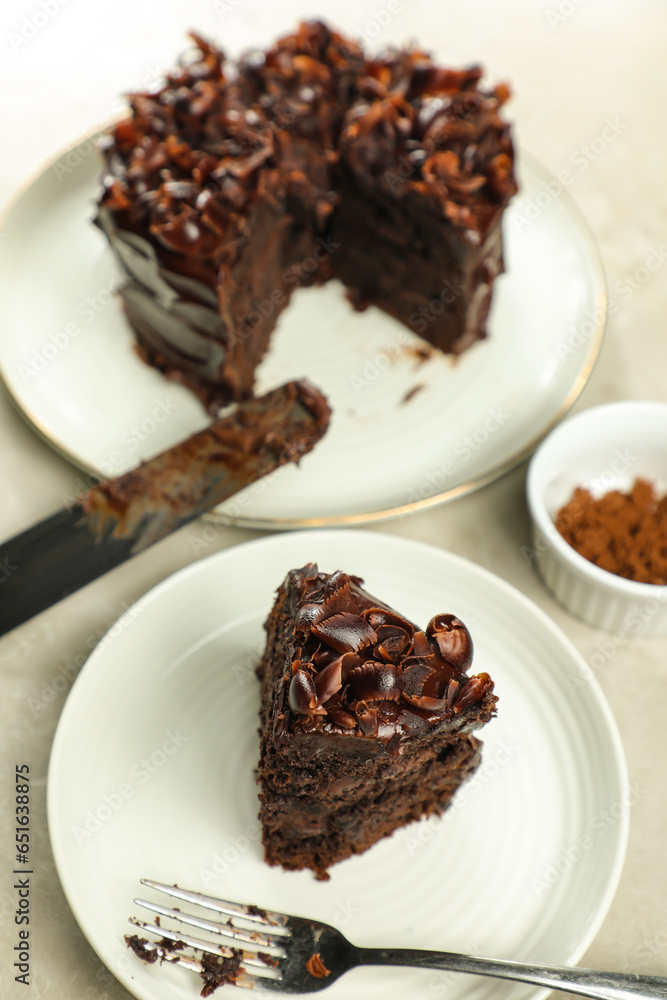 Chocolate Fudge Cake with fork and knife served in plate on food table top view cafe bake dessert Chocolate Fudge Cake with fork and knife served in plate on food table top view cafe bake dessert