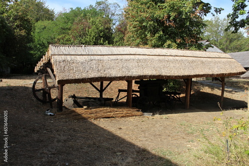A wooden table with a wheelbarrow