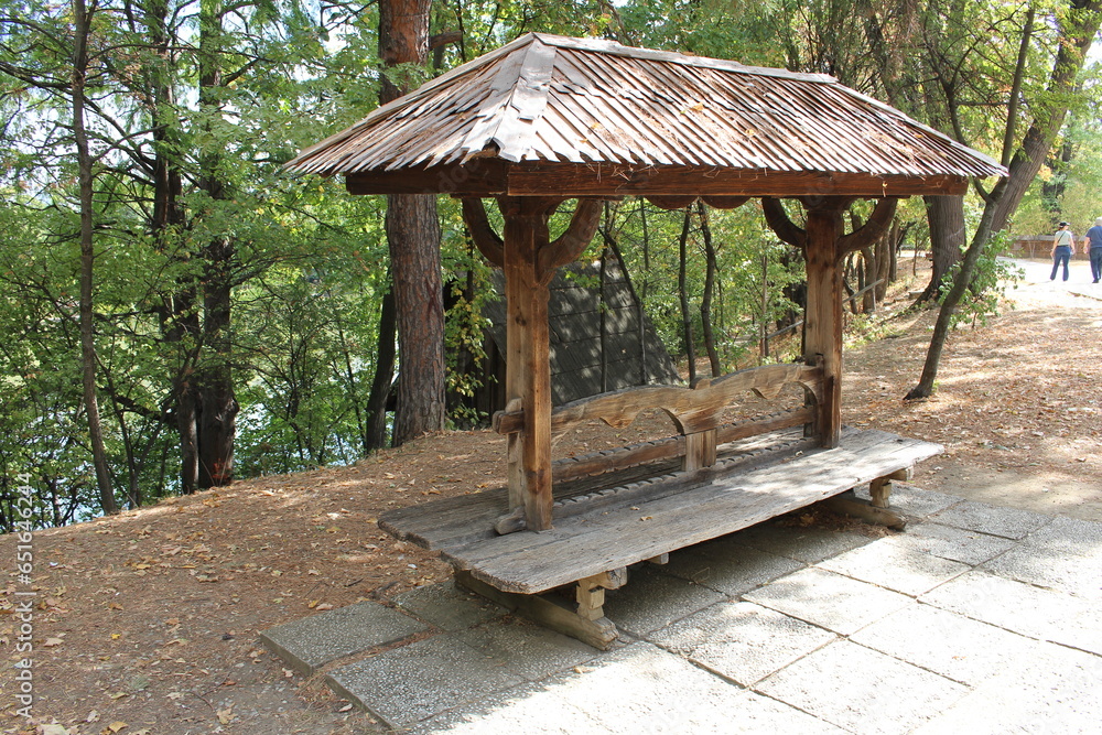 A wooden structure in a forest