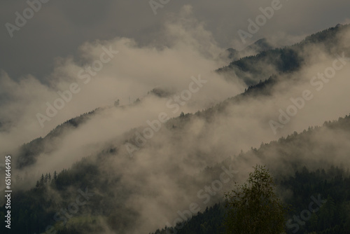 misty landscape in the mountains at a rainy autumn day