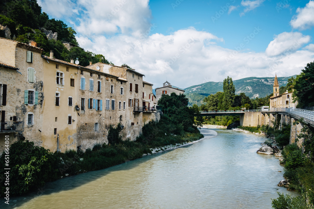 Overhanging houses facades over the Drome river in the medieval village of Pontaix in the South of France (Drome)
